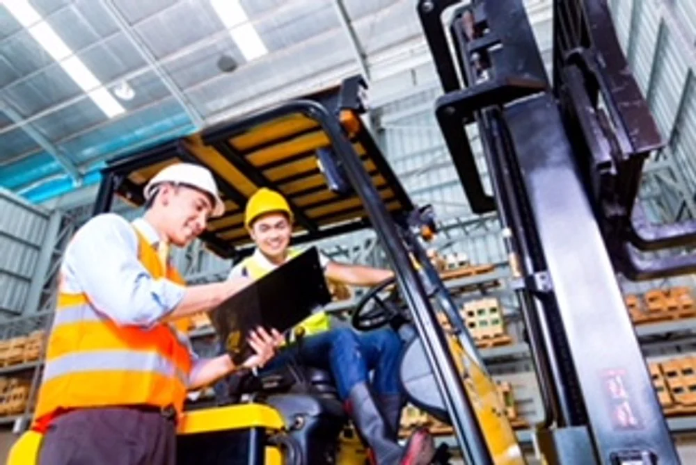 Safety professionals discussing operating activities around equipment